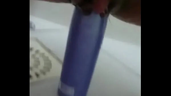 Show Stuffing the shampoo into the pussy and the growing clitoris fresh Movies